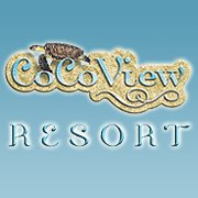 The sign for CoCo View Resort featuring its logo with a stylized turtle is displayed against a blue background, indicating its location on Roatan in Honduras.