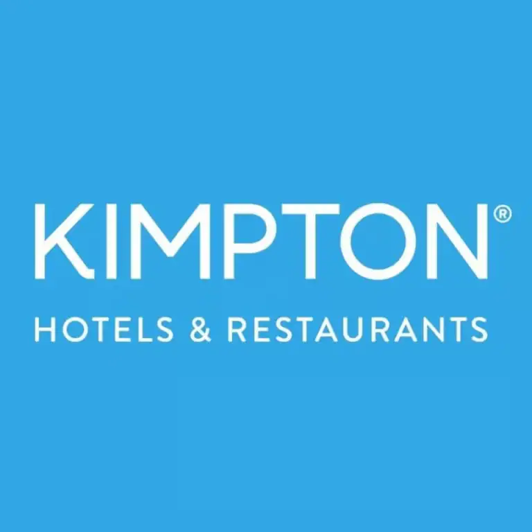 Kimpton Hotels & Restaurants logo displayed in white on a blue background for a Roatan, Honduras business listing.