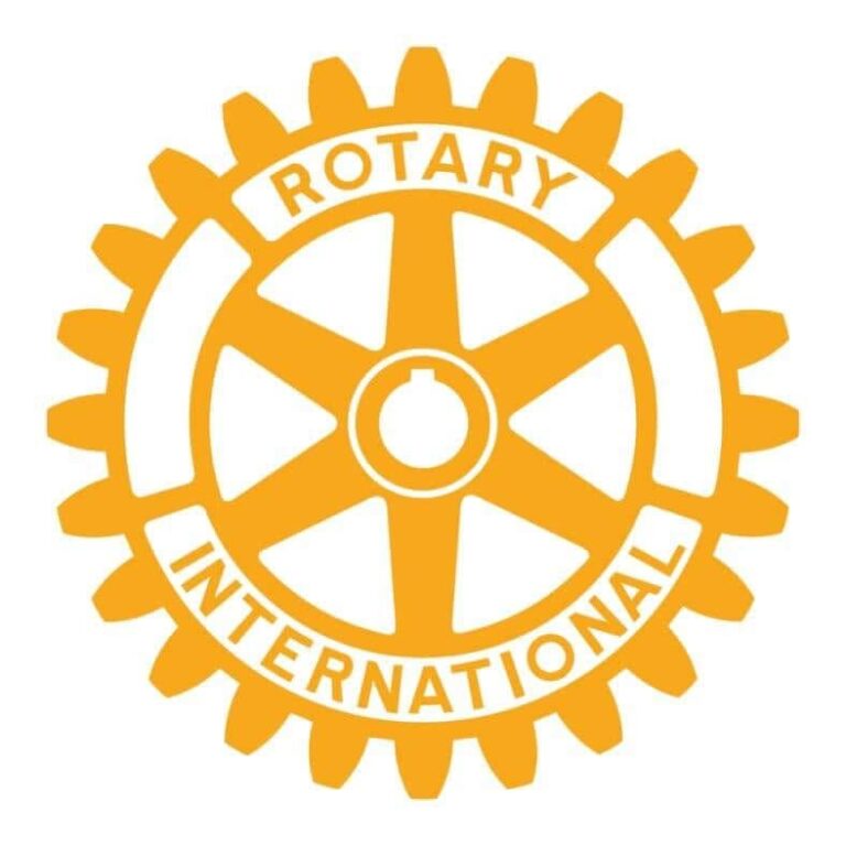 The Rotary International logo featuring a yellow gear wheel with the words Rotary International and Rotary on the top and bottom arcs, set against a white background, representing the global service organization based in Honduras and Roatan.