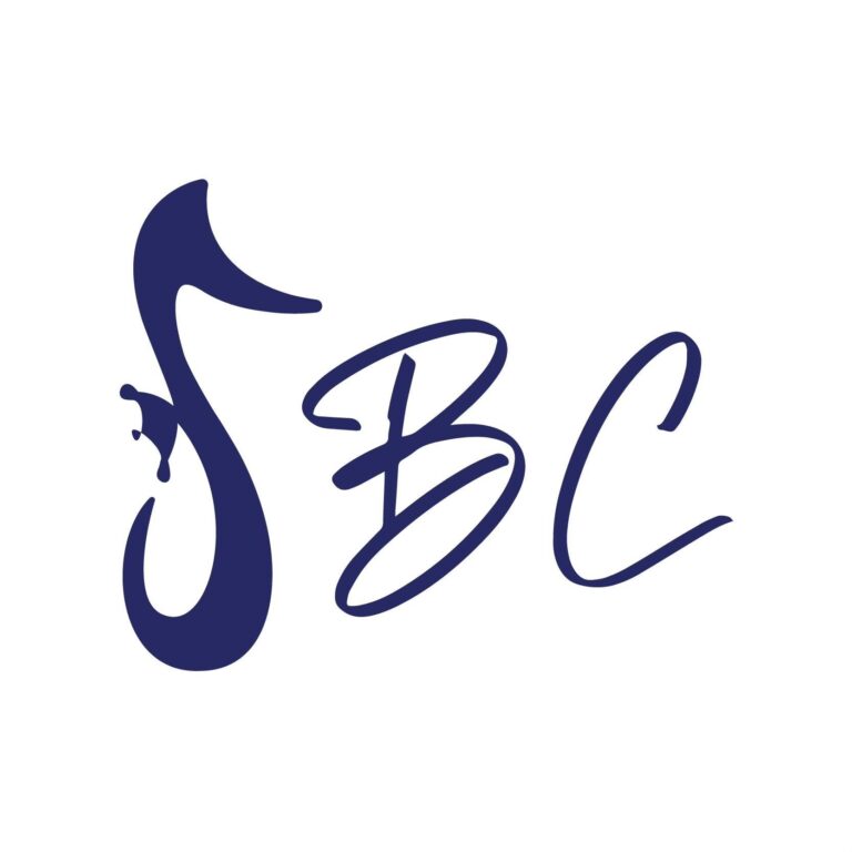 Close-up of a custom-designed dark blue logo featuring a whale fin on the top and elegant cursive text spelling 'Roatan' on a white background, representing a business in Roatan, Honduras.
