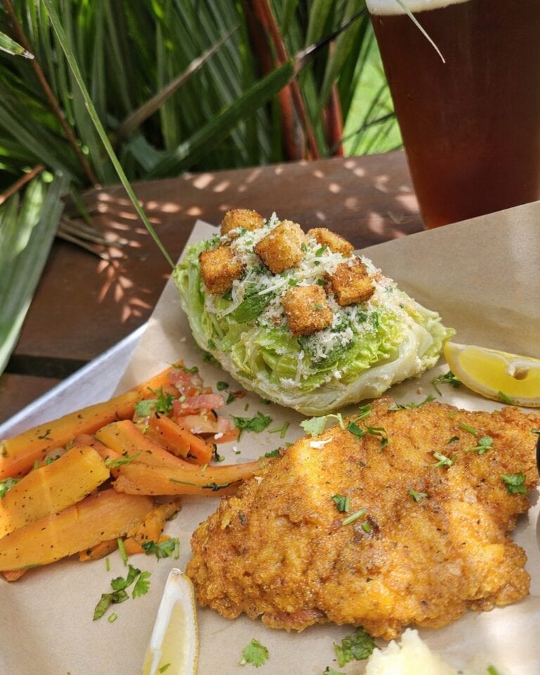 Delicious fried chicken and Caesar salad at Roatan Island Brewing.