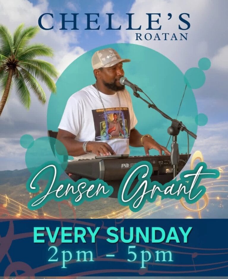 Jensen Grant performing live on Roatan, Honduras, playing the keyboard and singing into a microphone against a scenic background with palm trees and cloudy skies.
