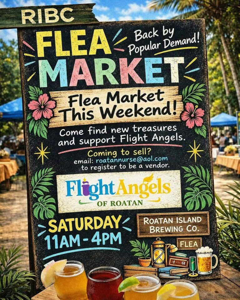 Colorful handmade chalkboard sign advertising a flea market on Roatan, Honduras, with floral decorations and playful lettering, set outdoors with trees and blue tents in the background.