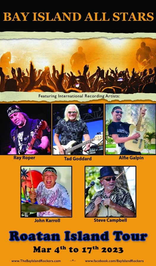 A promotional poster for the Bay Island All Stars music event on Roatan, Honduras, featuring photographs of five international recording artists—Ray Roper, Tad Goddard, Alfie Galpin, John Karroll, and Steve Campbell—showing them performing or posing outdoors, with a concert scene at sunset and details about the Roatan Island Tour from March 4th to 17th, 2023.