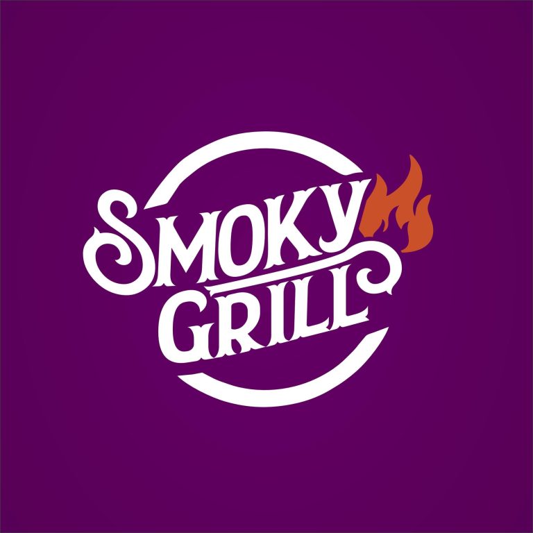 A colorful sign with a purple background and orange flames displays the word "Spicy" for a business on Roatan, Honduras, likely offering hot or spicy food.