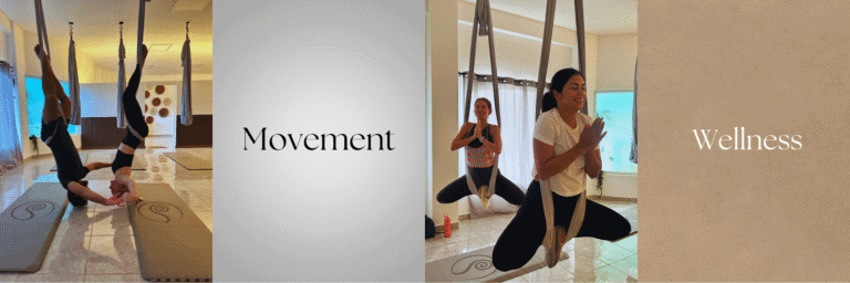 Two women practicing aerial yoga with fabric hammocks indoors in Roatan, Honduras, surrounded by natural light and neutral-colored walls, with the words "Movement" and "Wellness" overlaid on the image.
