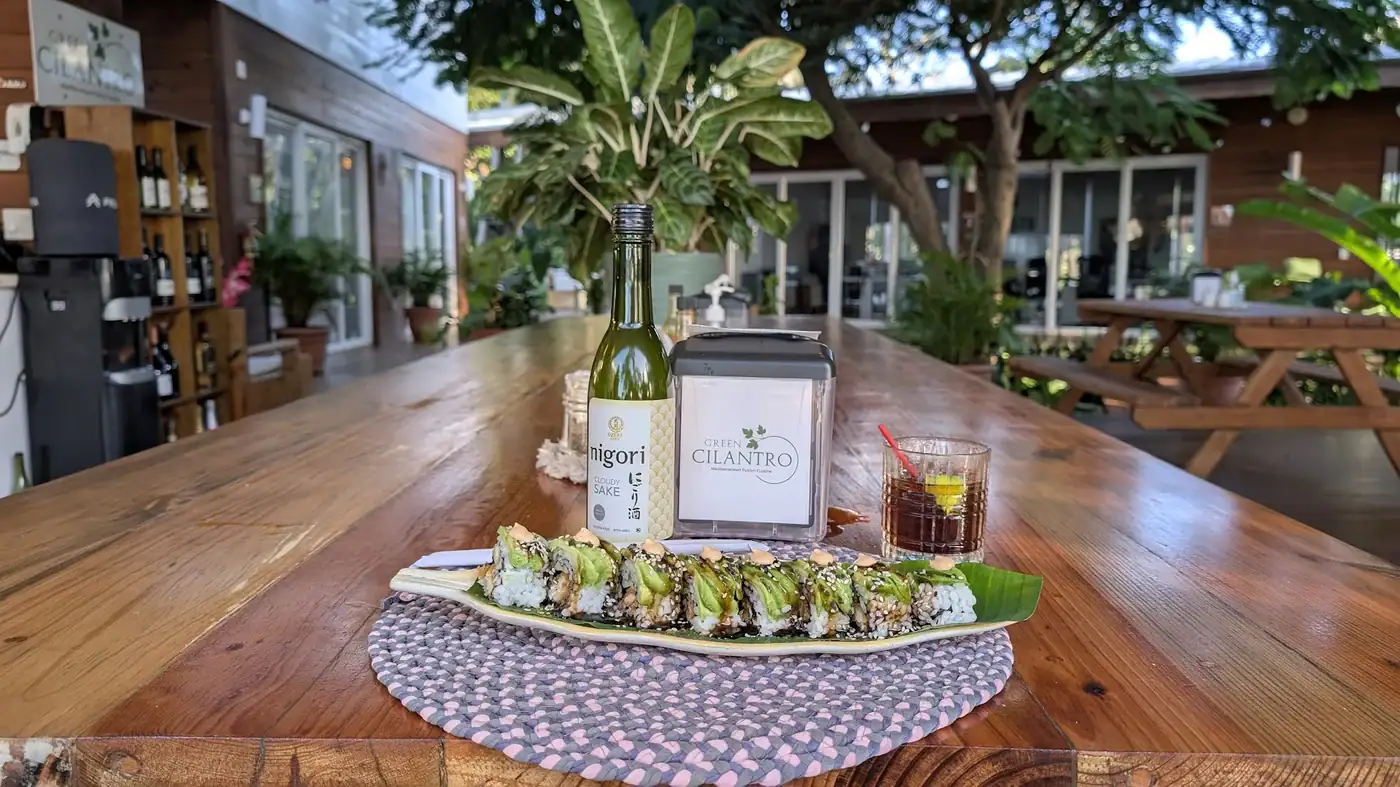 Sushi roll and sake at Green Cilantro during Saturday sushi night