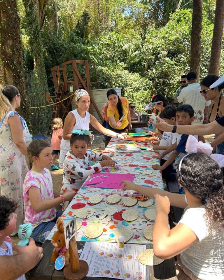 Children participating in an Easter egg hunt outdoors.