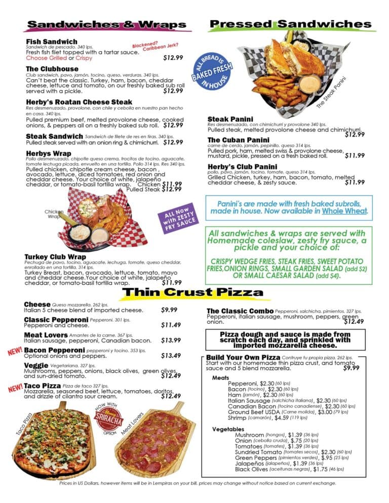 A menu displays a variety of sandwiches, wraps, and pizzas with descriptions, prices, and some dishes featured with bold headings, set against a background that includes images of the food items, framed by a business listing on Roatan, Honduras.