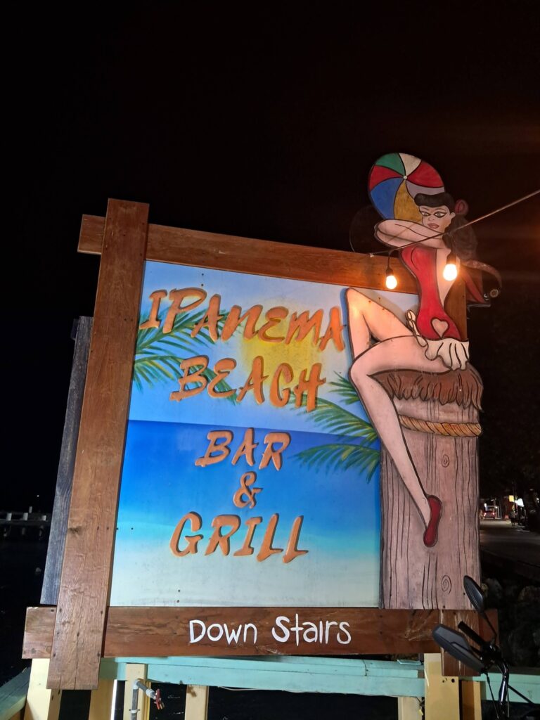 Bright sign for Ipanema Beach Bar & Grill at Roatan, Honduras.