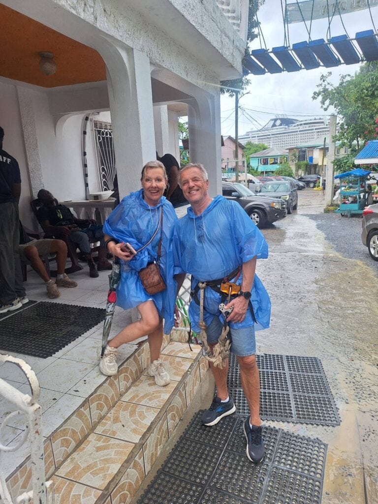 Guides in rain ponchos ready for a beach tour in Roatan, Honduras.