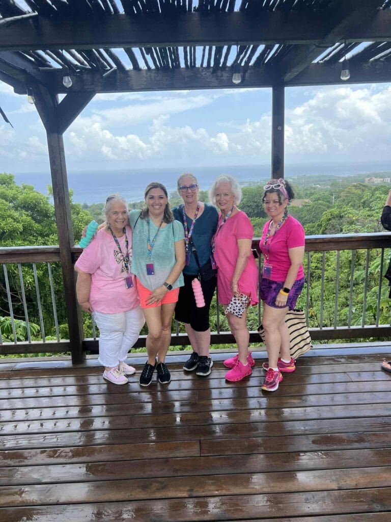 Group of women enjoying a sightseeing tour at Roatan's scenic lookout point.