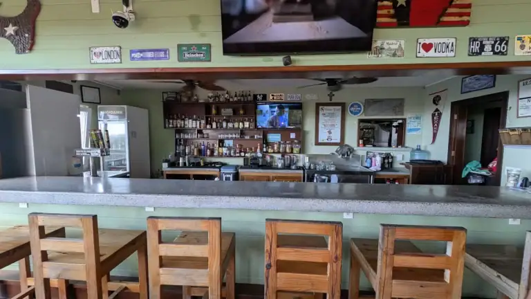 Interior bar and seating area at Kristi’s Overlook in First Bight