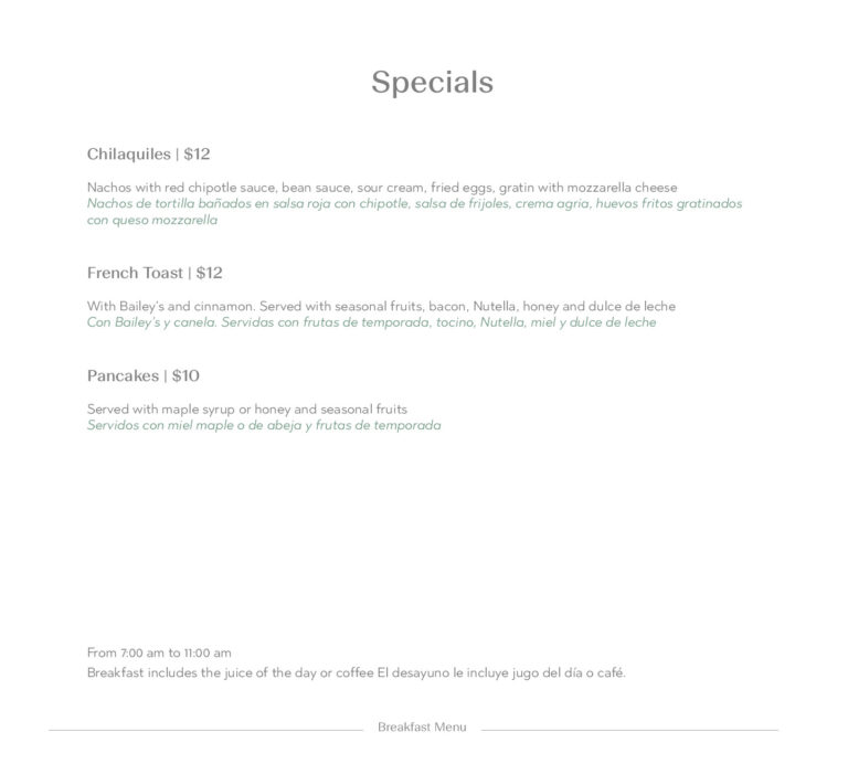 A business menu on Roatan in the Bay Islands of Honduras displaying breakfast and snack options with English and Spanish descriptions.