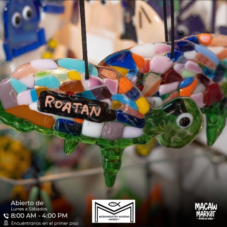 Colorful mosaic glass chameleon with "Roatan" tag.