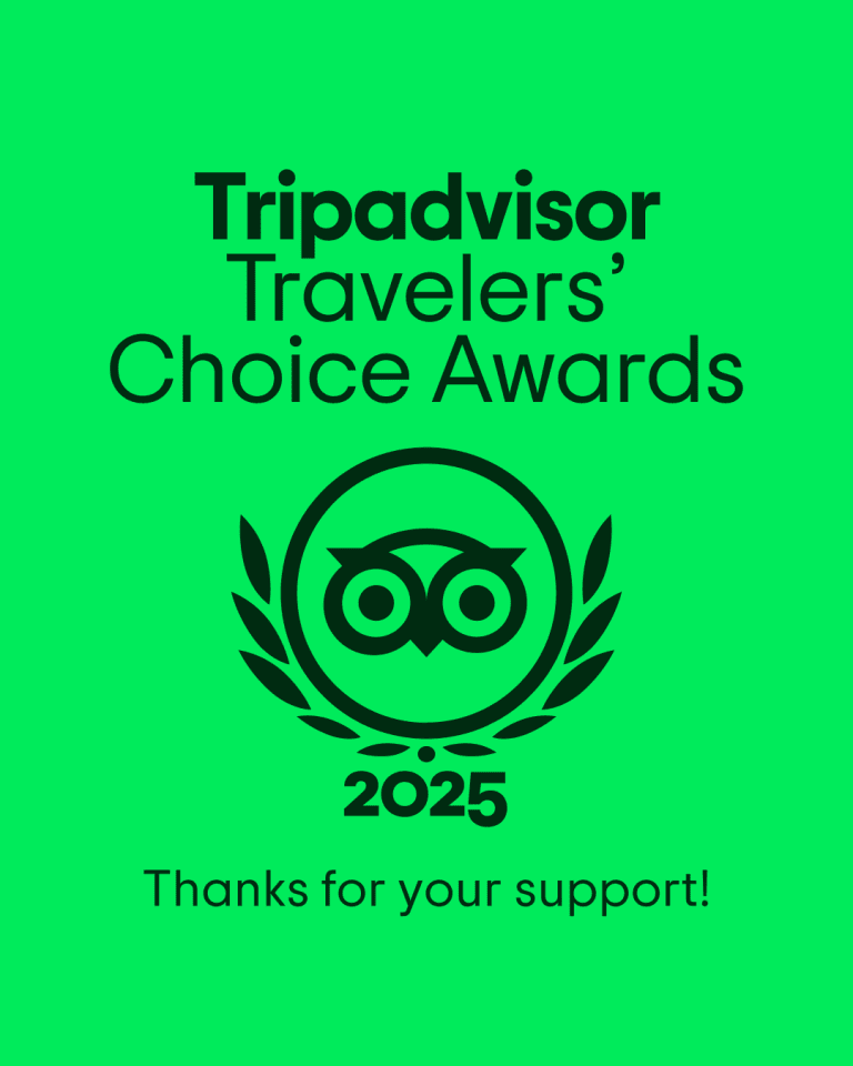 A green award badge features a pair of binoculars surrounded by a laurel wreath, with the text "Tripadvisor Travelers' Choice Awards 2025" and "Thanks for your support!" indicating recognition for a business in Roatan, Honduras.