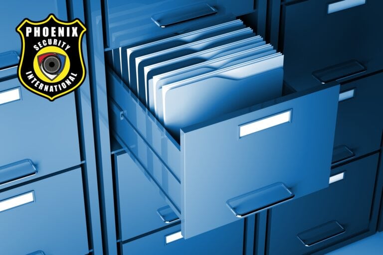 A filing cabinet with open drawers filled with organized documents, featuring a Phoenix Security International logo on the left side.