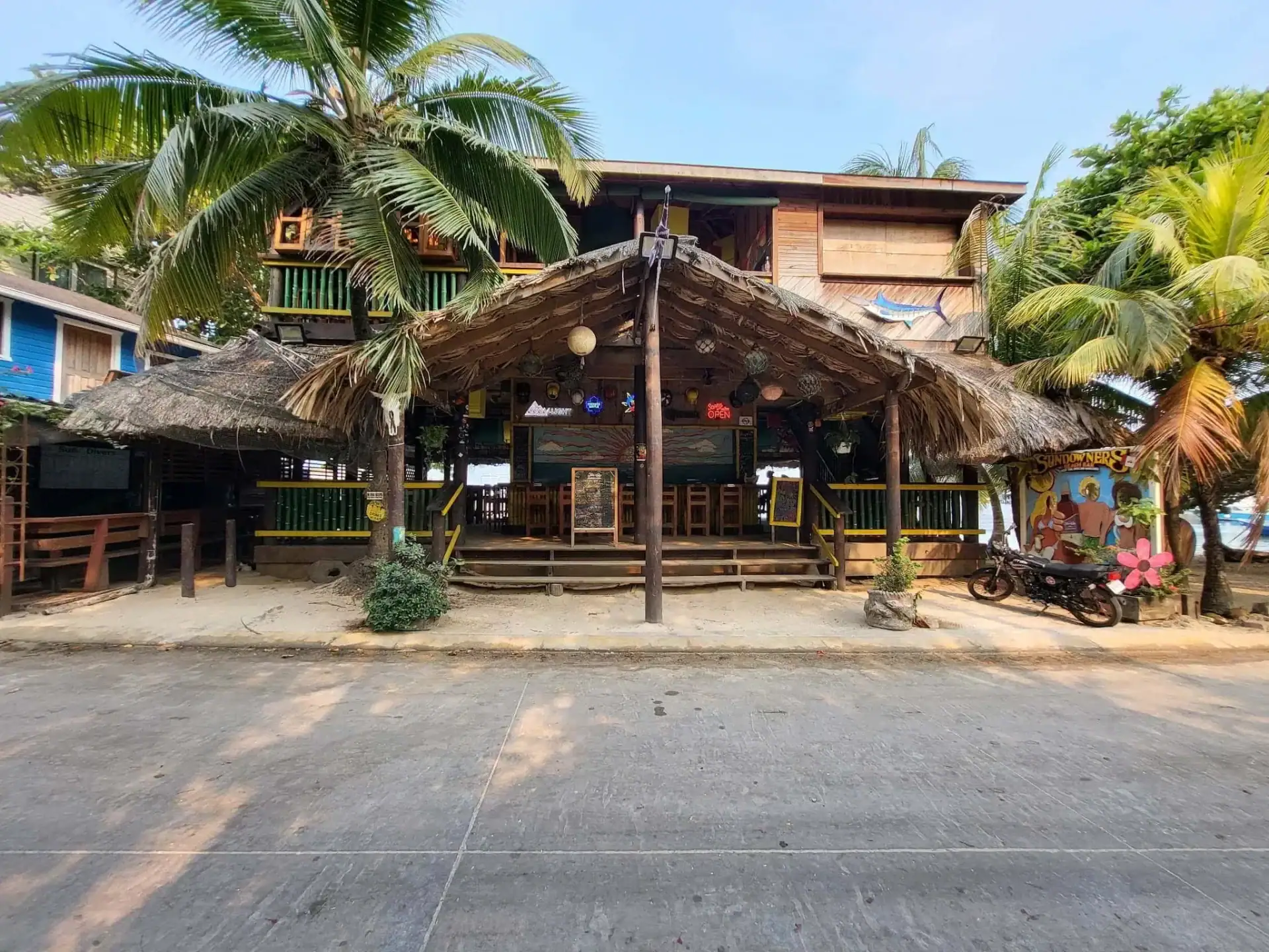 Exterior entrance of Sundowners Beach Bar on Half Moon Bay in West End Roatan