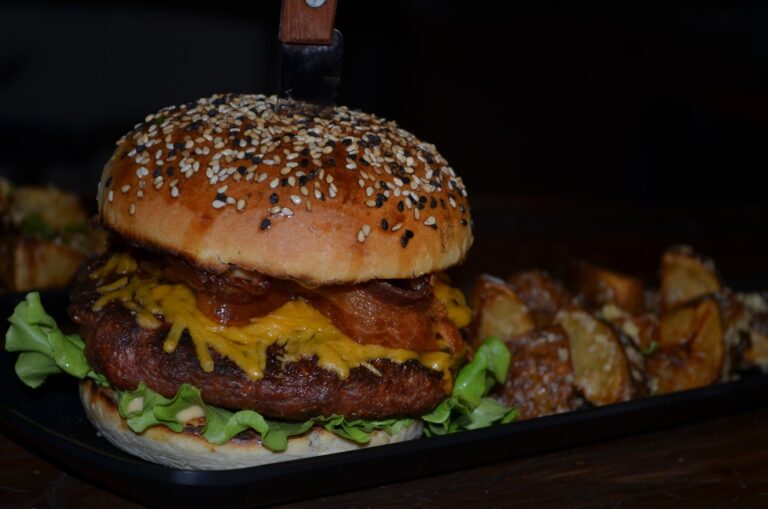 Cheeseburger with bacon, lettuce, and sesame seed bun at The Estancia Steak House.