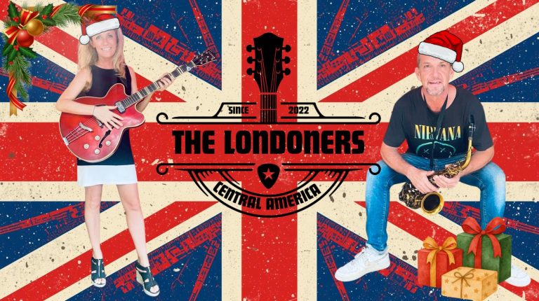 Two musicians wearing Santa hats and holding instruments, a woman with an electric guitar and a man with a saxophone, sit against a backdrop featuring the Union Jack flag and Christmas decorations, representing "The Londoners" band from Roatan, Honduras, central America.