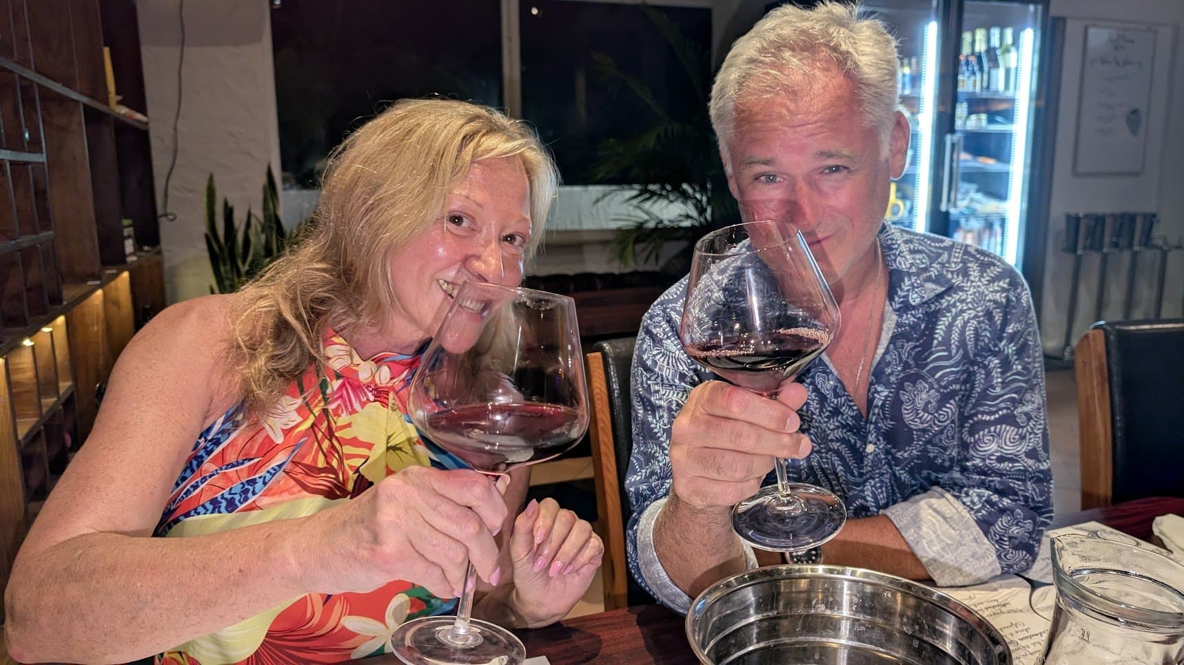 Guests enjoying red wine at the Wine Not African Safari wine tasting in French Harbour Roatan